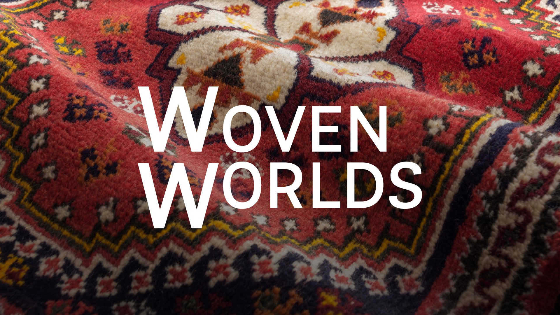 An image of a patterned rug with the overlay text 'Woven Worlds' in white capital letters.